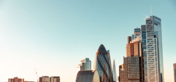 Sun setting over buildings in London